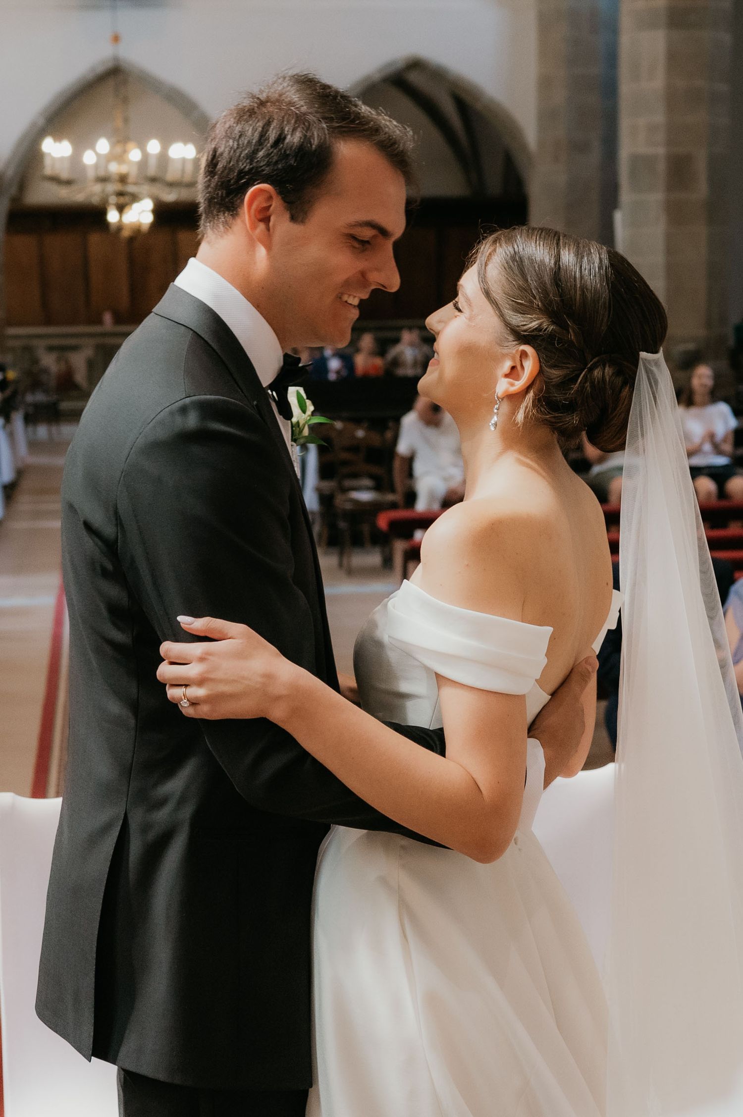 Bride and groom share an intimate moment at the altar during their church wedding ceremony.