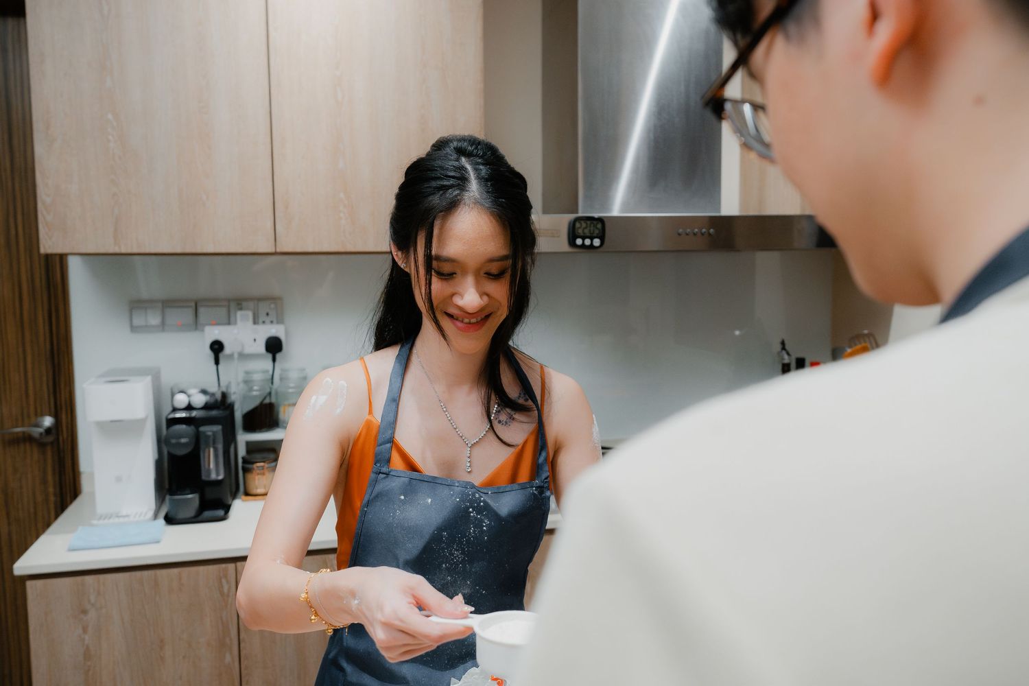 Happy moment shared in the kitchen while cooking together.