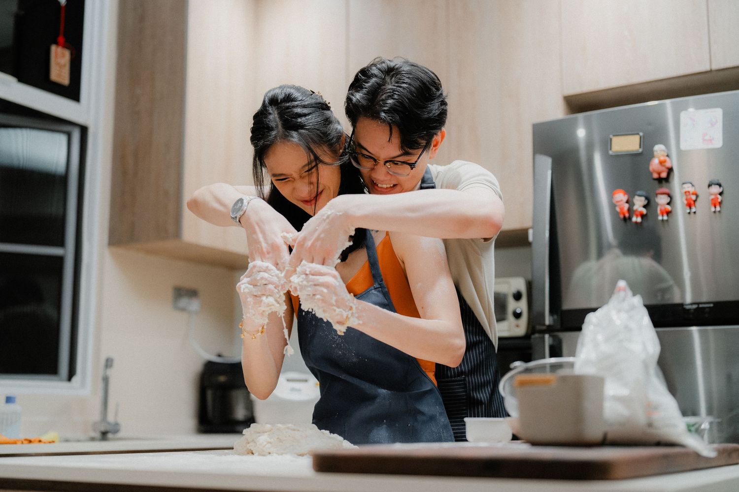 Cooking together while having fun in a modern kitchen.