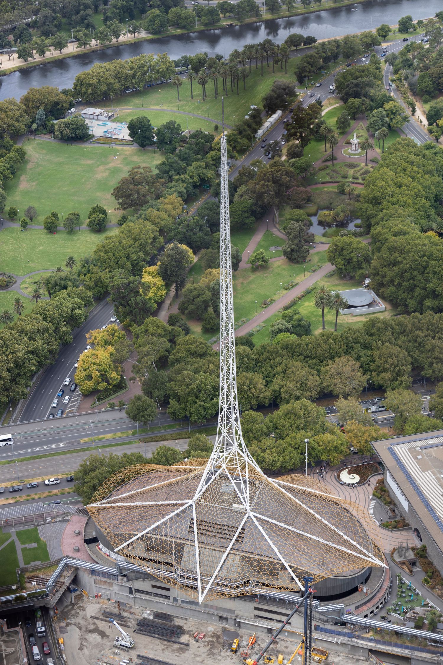 Aerial view of an arts centre with a towering white spire and circular roof.