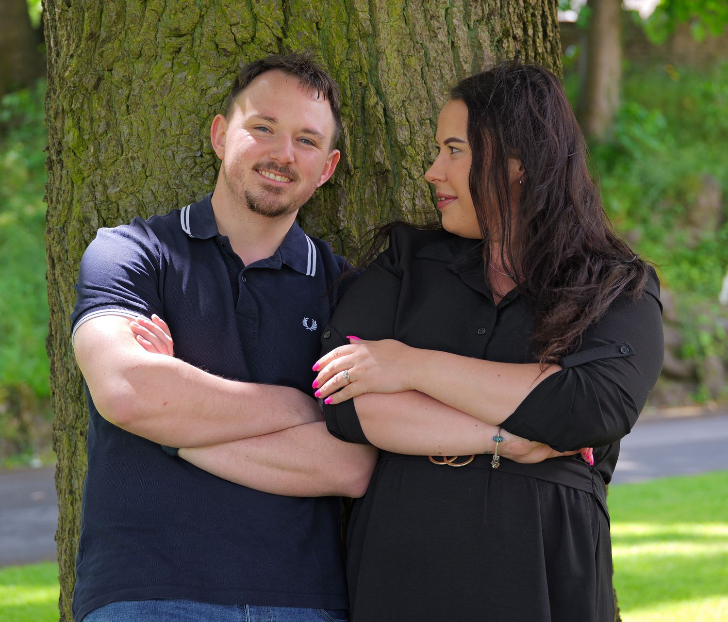 Playful romantic couples portrait from outdoor engagement photoshoot. Photographer is Isobel Hughes Photography in Haworth West Yorkshire.