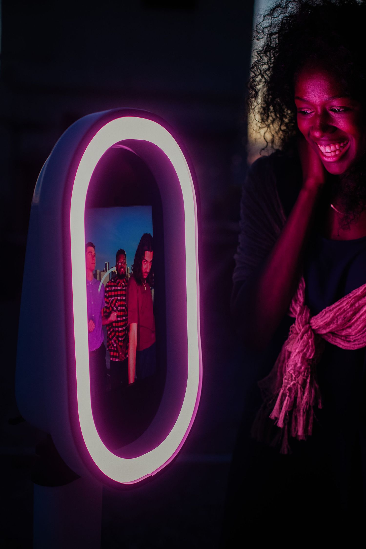 A sequence of photos showing illuminated neon letter O signs in purple and white lighting against dark backgrounds.