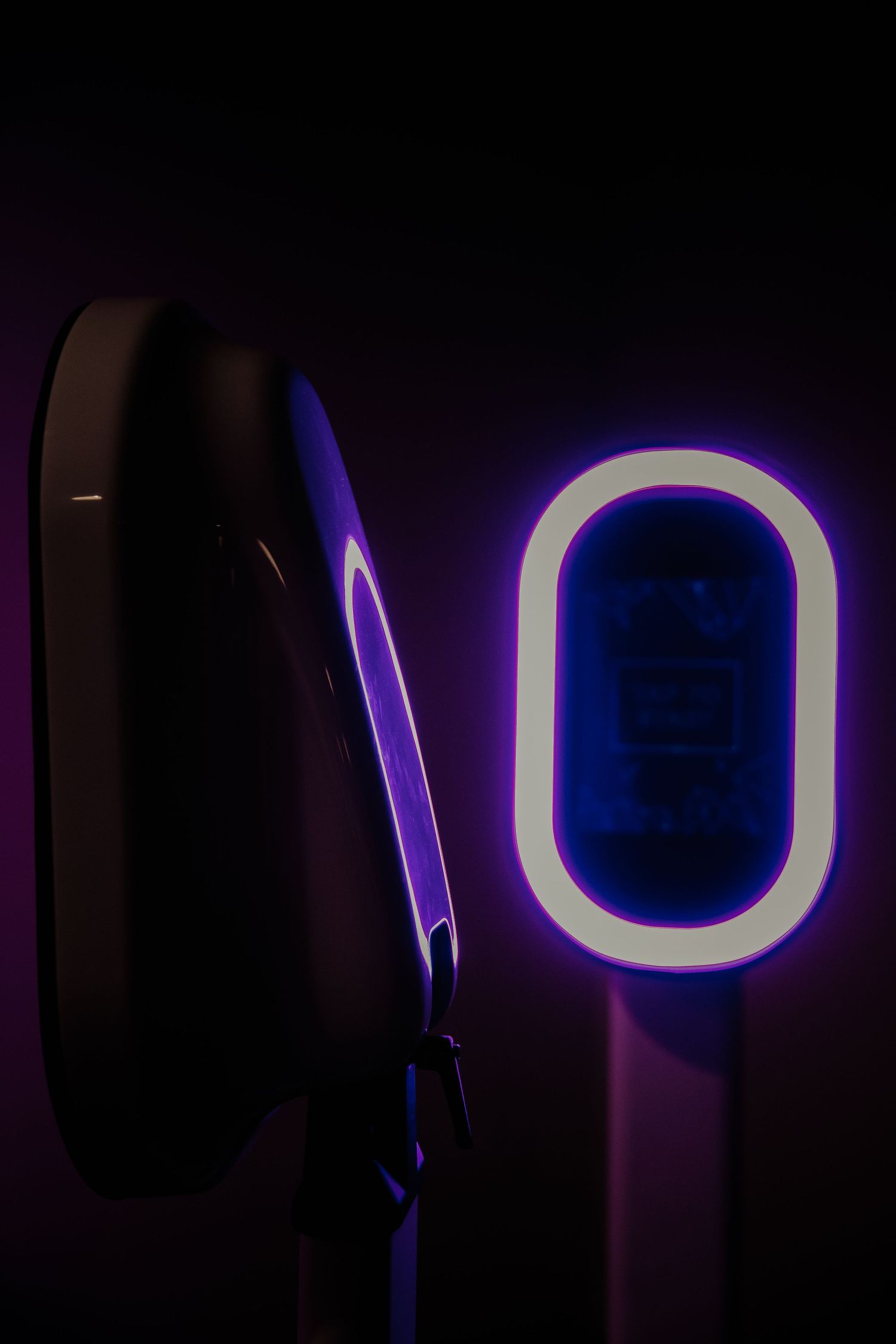 A sequence of dark images shows a glowing purple light trail creating circular patterns against a black background.