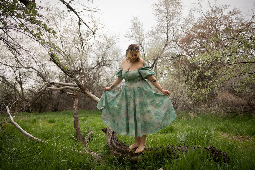 A series of ethereal dance poses captured in a natural outdoor setting with blooming trees and soft lighting.
