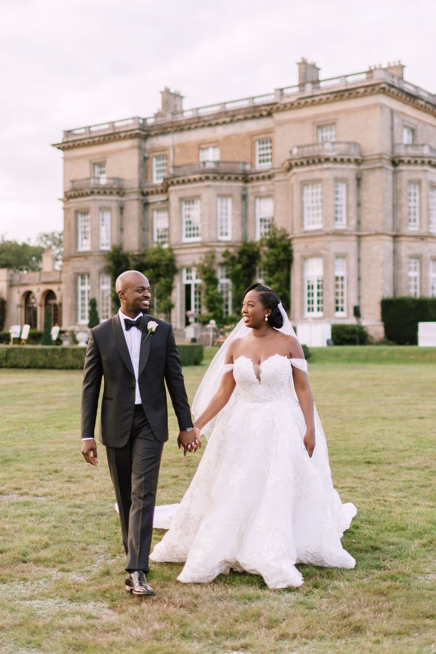Couple walking in front of Hedsor House