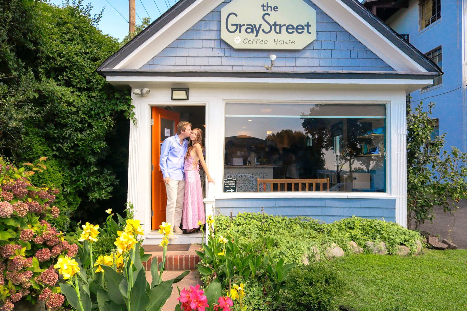 Engagement-style photo of couple outside The Gray Street Coffeehouse in Allenhurst, New Jersey—photographed by Michelle Baum Photography.