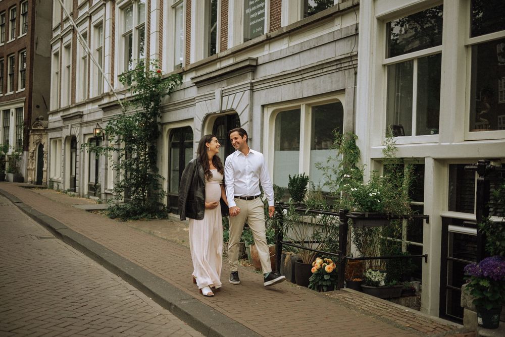 Elegant architectural details of classic Amsterdam buildings along a quiet street.