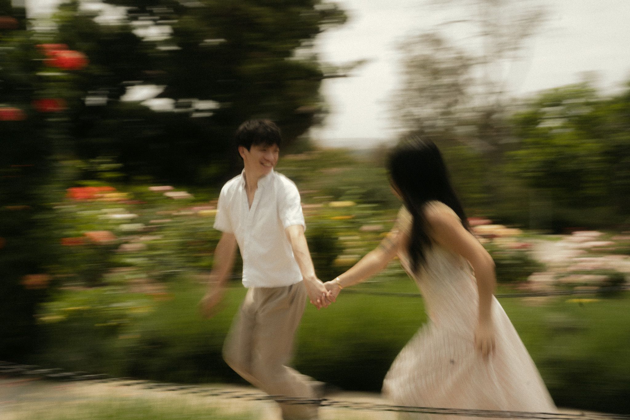 Huntington Library Engagement Photos | Running Through Rose Garden