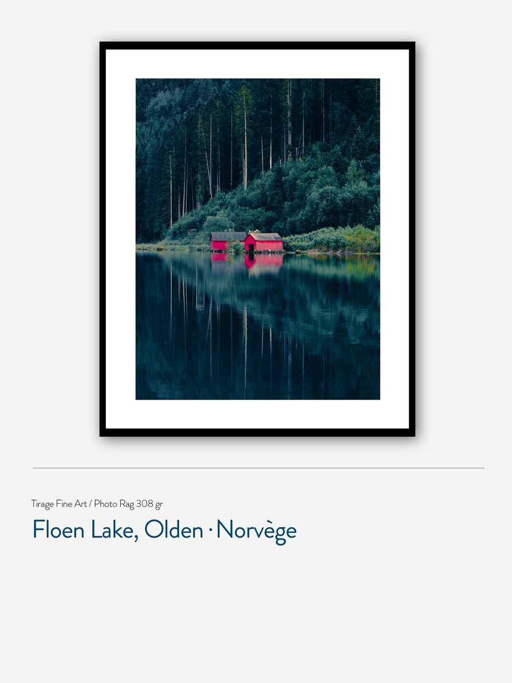 Framed fine art print of red boathouses reflecting on Floen Lake surrounded by dark pine forests in Olden, Norway.