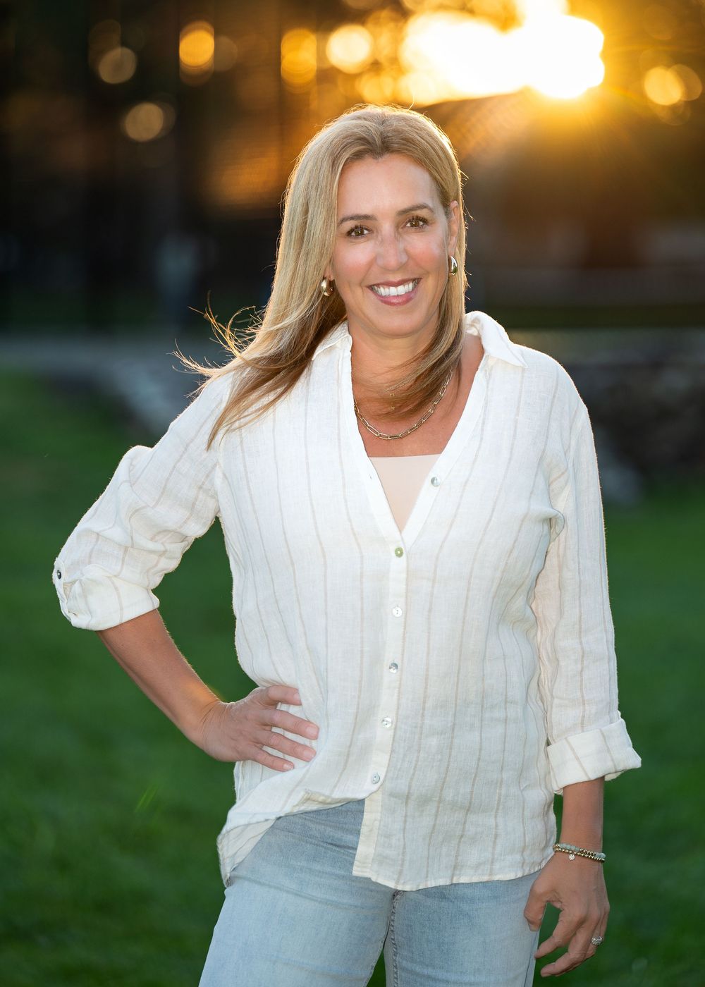 Outdoor portraits of a person in white button-down shirt during golden hour.