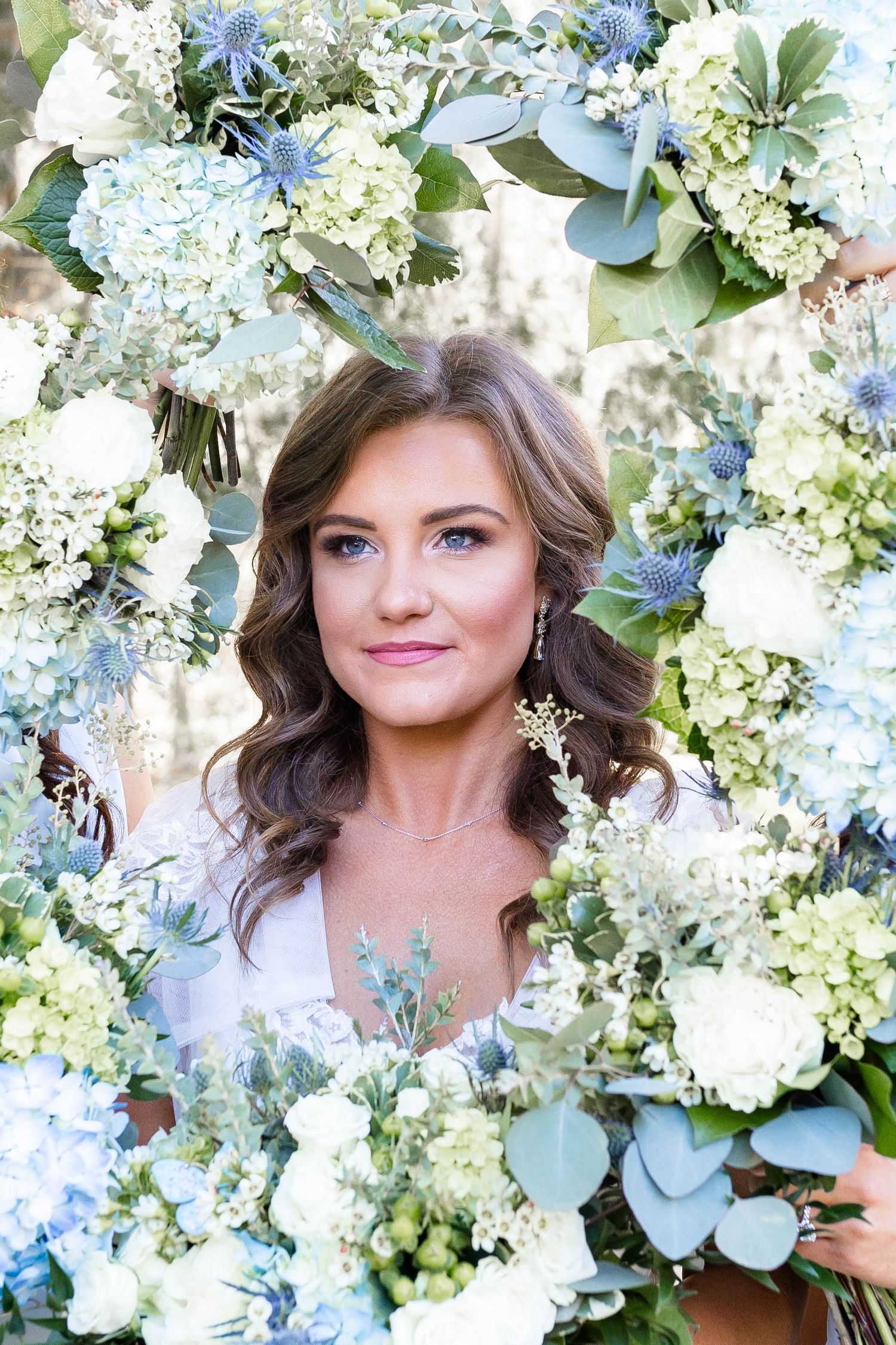 bride in flower bouquets