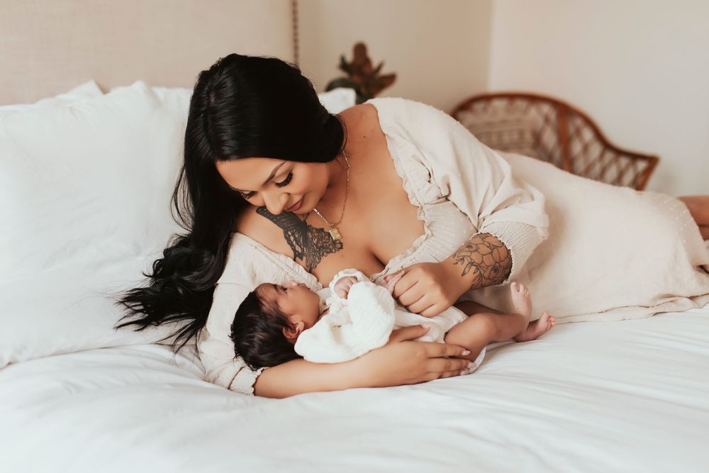 San Diego newborn photographer family cuddling baby