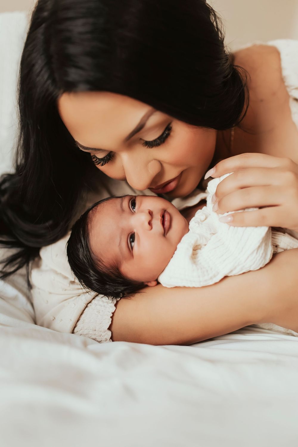 San Diego newborn photographer family cuddling baby