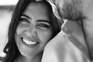 A sequence of close-up black and white photos showing joyful expressions and smiles.