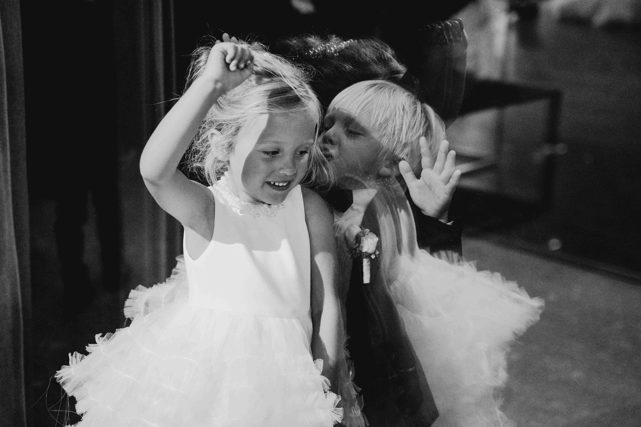 Black and white wedding photo sequence capturing intimate moments between newlyweds.