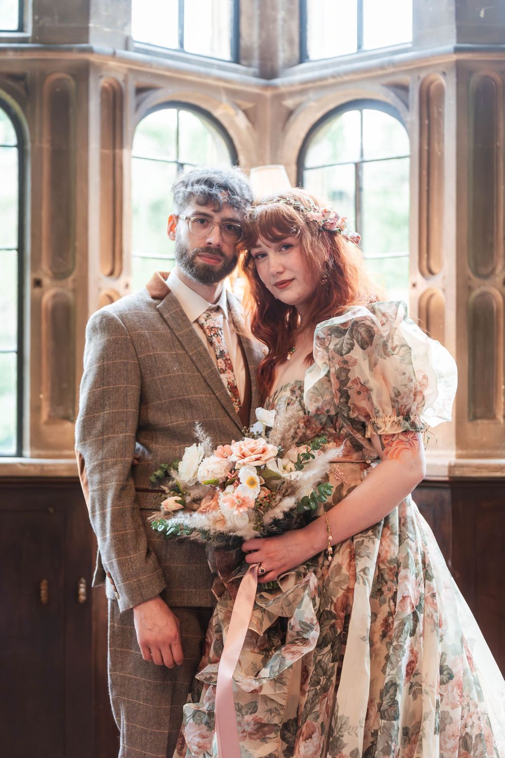 Wedding ceremony inside Thornbury Castle hall bride and groom pose