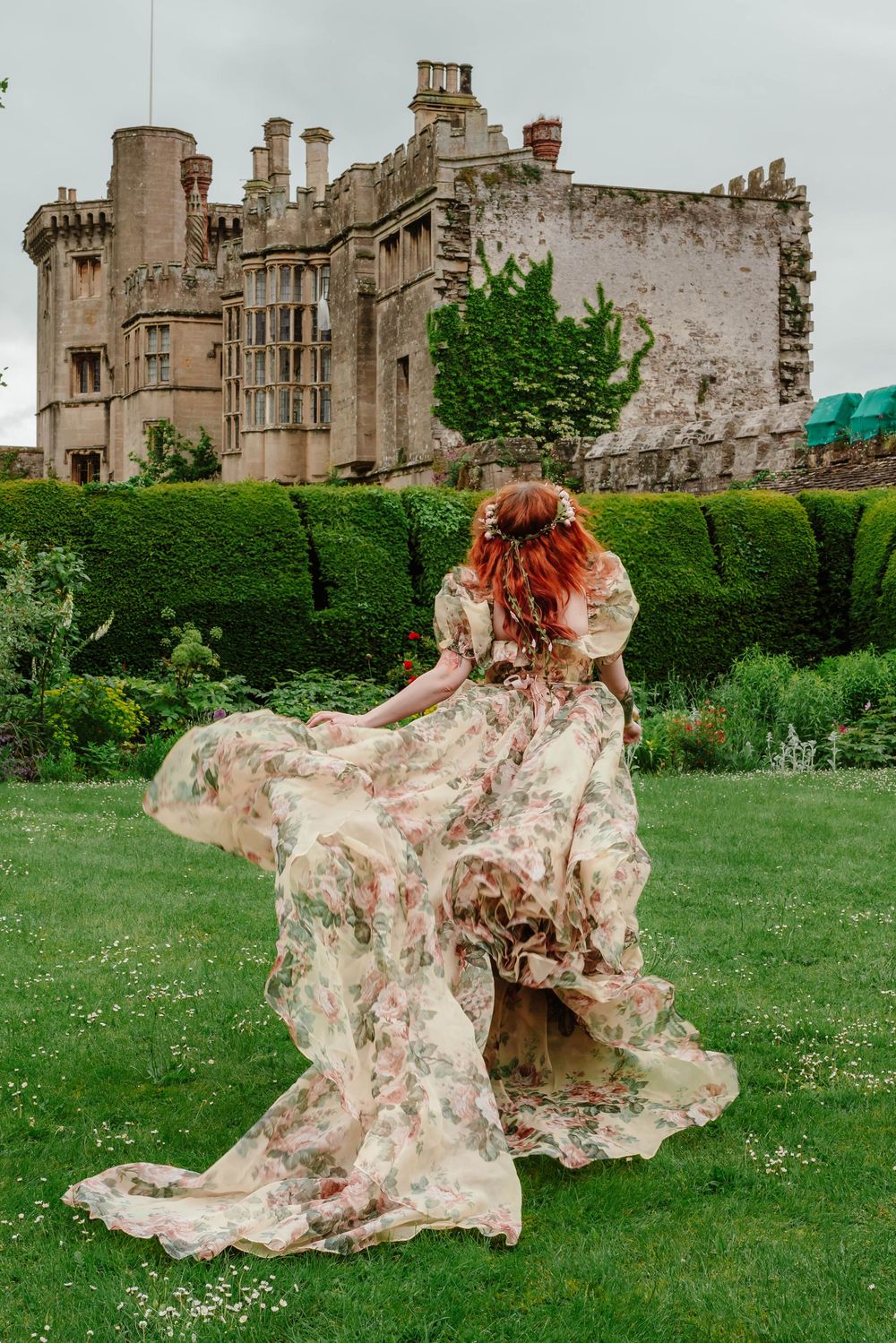 Bride and groom portraits at Thornbury Castle gloucestershire brides flowing gown