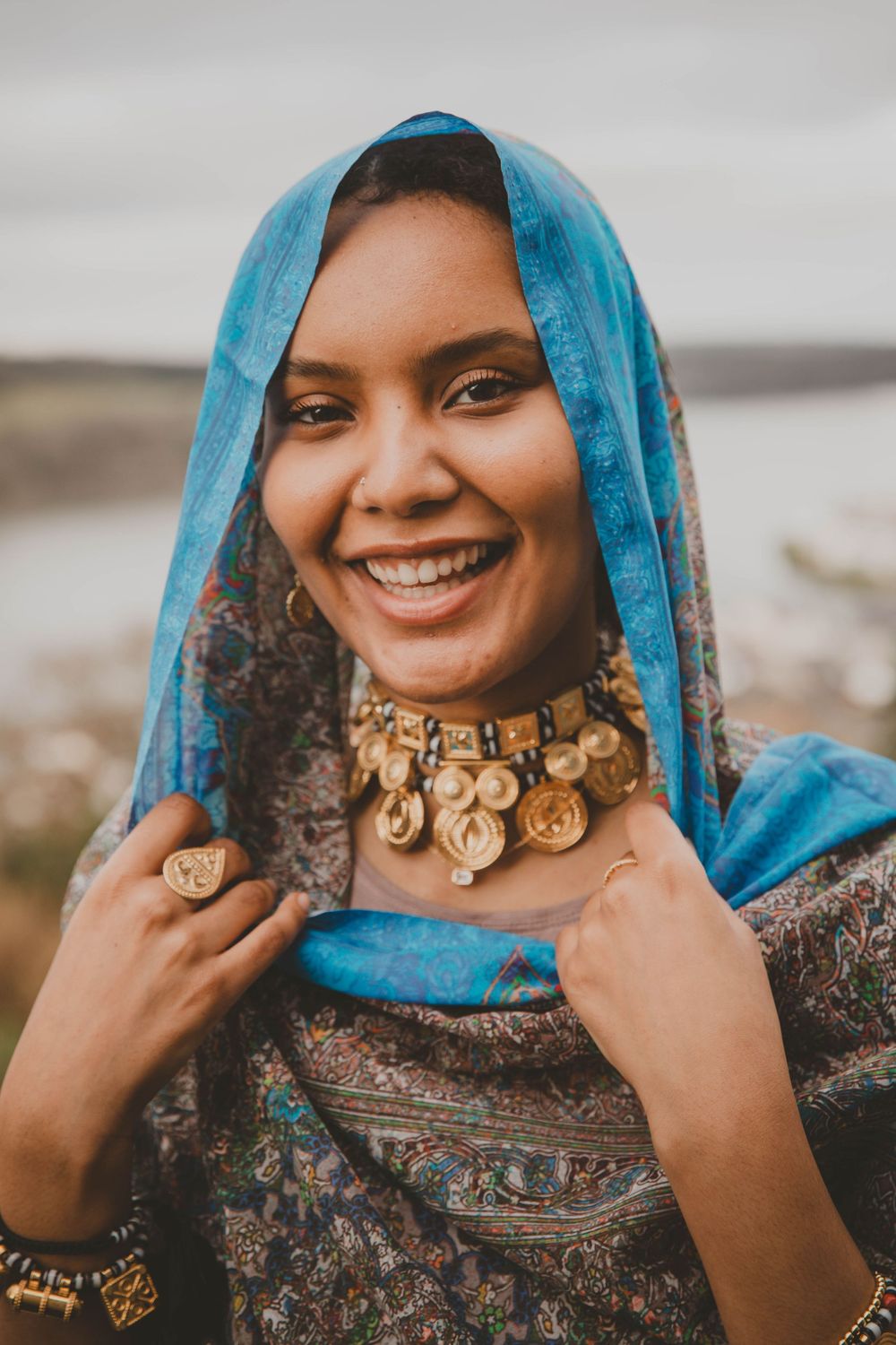 PORTRAIT Sudanese/Welsh Model wearing Toub in NORTH WALES, designed by HIMA RAHAMA. Photoshoot and Jewellery by KUKU Jewellery