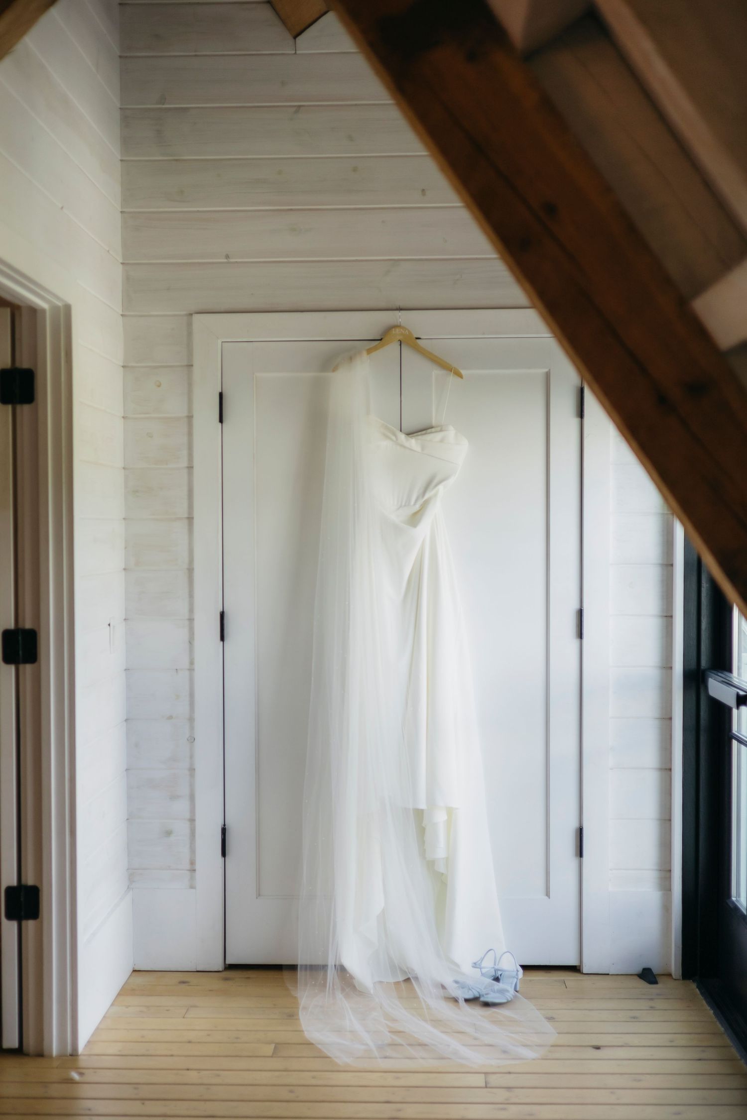 Wedding dress hanging in a minimalistic interior