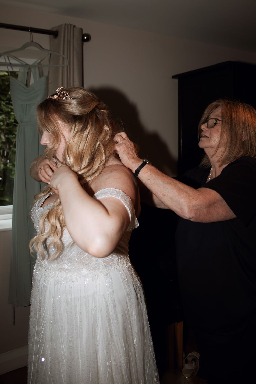 A sequence of photos shows a bride getting ready, adjusting her flowing white wedding dress in a dimly lit room.