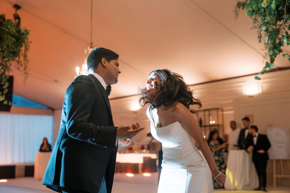 Bride and groom celebrating their grand entrance at Palácio do Correio-Mor wedding in Portugal