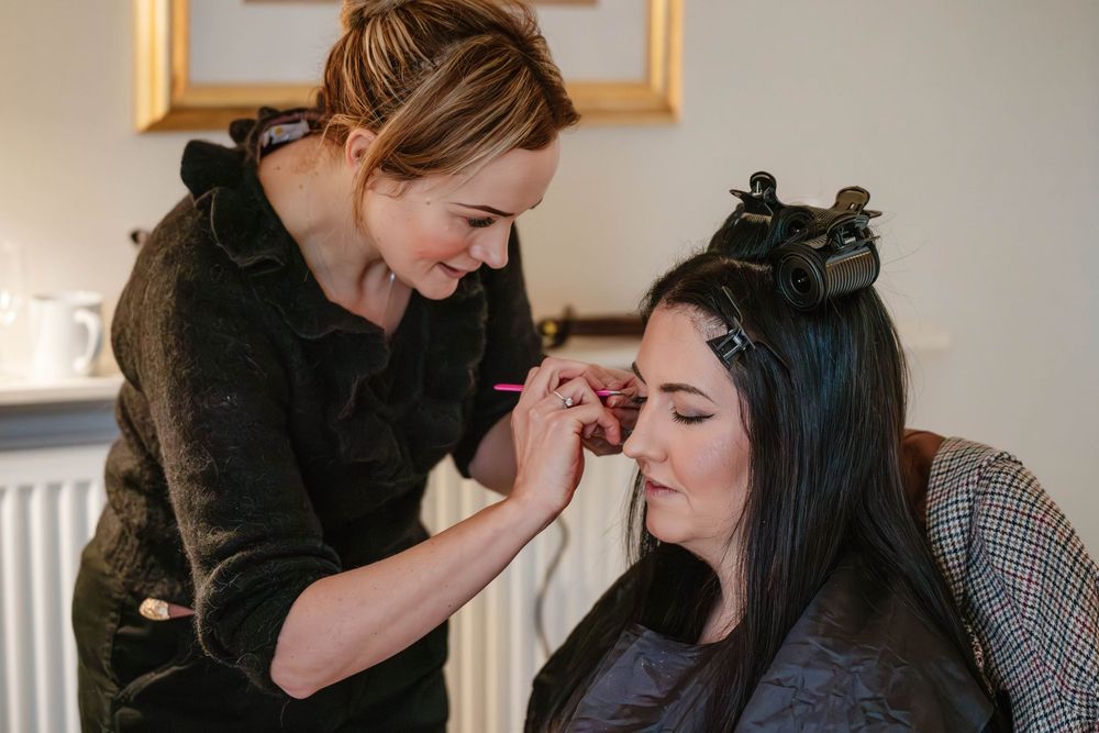 Matara Centre Wedding Photography Zara Davos Cotswolds Photographer Gloucestershire Stroud  bride having make up system