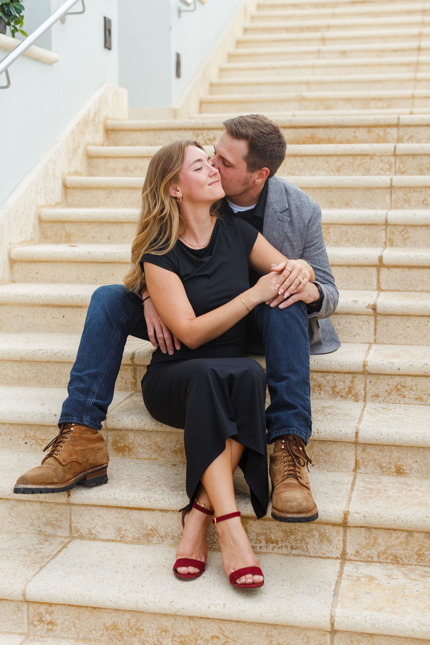 Couples portrait. Seated on stairs at the Condado Vanderbilt Hotel in San Juan, Puerto Rico.