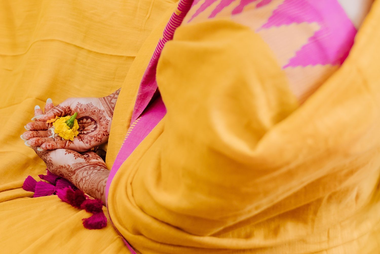 Family blessing the bride during the Punjabi Chooda ceremony during her indo-norwegian wedding in Chandigarh