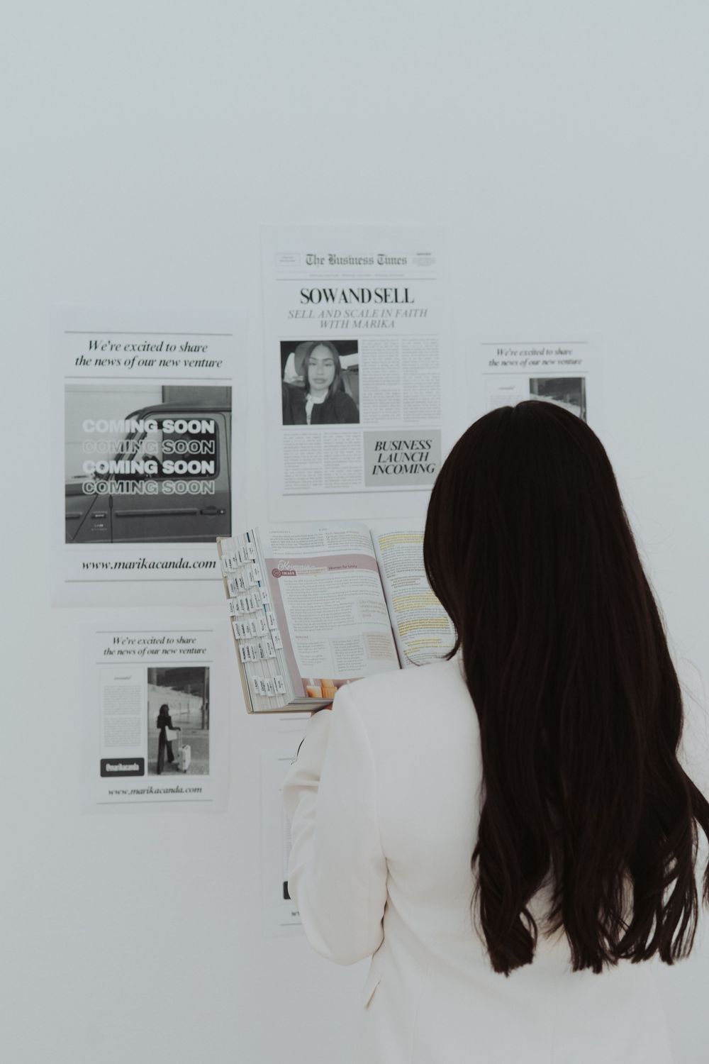 Wall display of business documents and coming soon announcements.