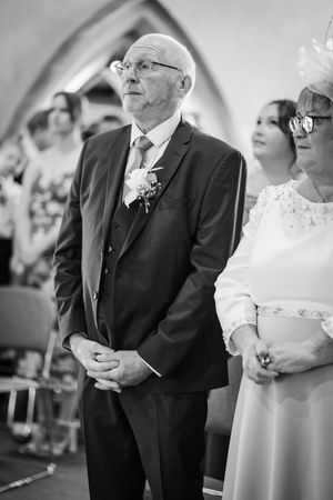 Black and white photo sequence showing emotional moments during a traditional church wedding ceremony.