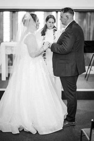 Multiple shots of a wedding couple's intimate first look sequence showing emotional reactions in black and white.
