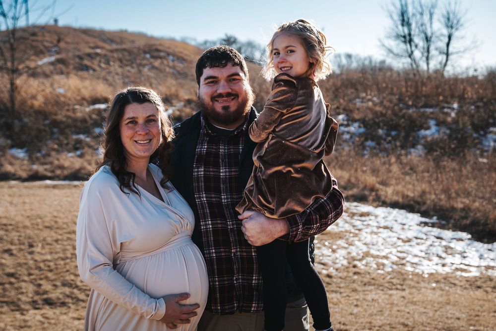 Casual outdoor family portraits taken on a sunny winter afternoon.
