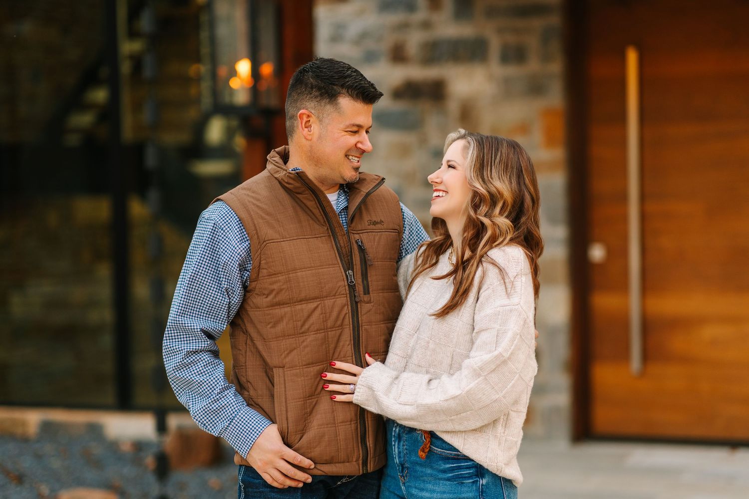 A couple shares tender moments together in a series of sweet outdoor photos with rustic backgrounds.