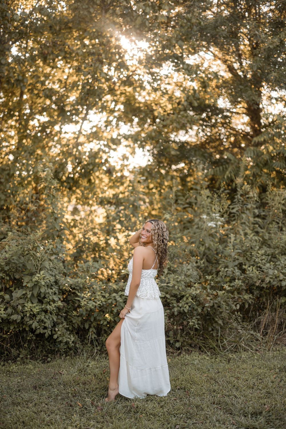 Four sequential photos of a white wedding dress flowing in the golden sunlight against a natural outdoor backdrop.