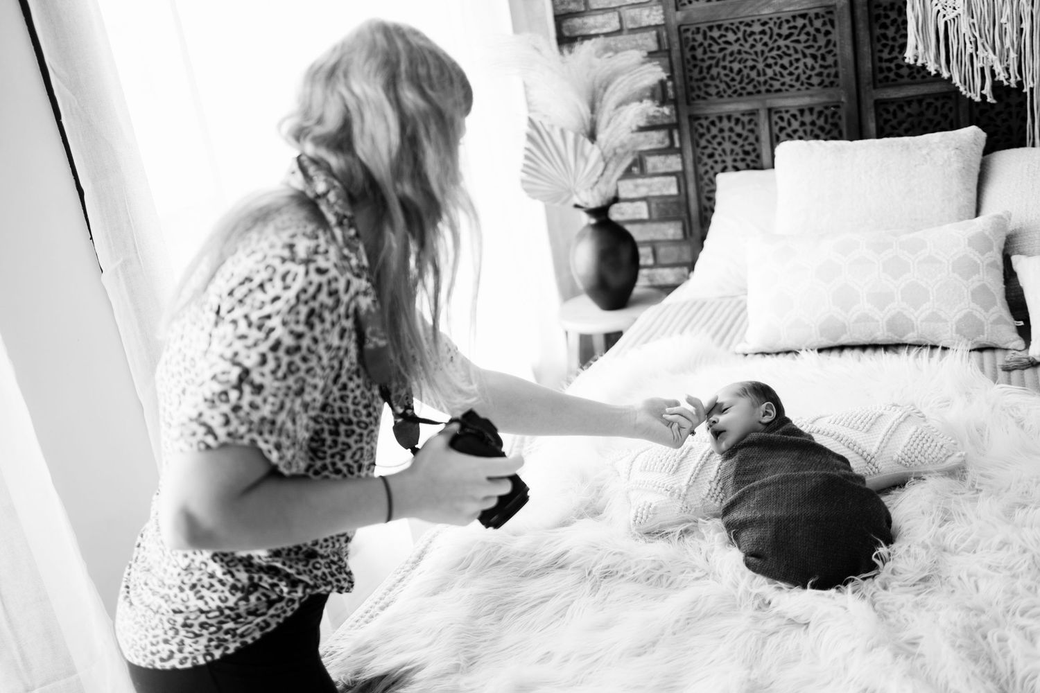 behind the scenes during a newborn photography session at Watertown WI natural light studio