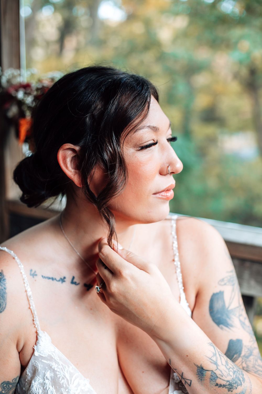 Artistic bridal portrait series showing delicate lace dress details and tattoos.