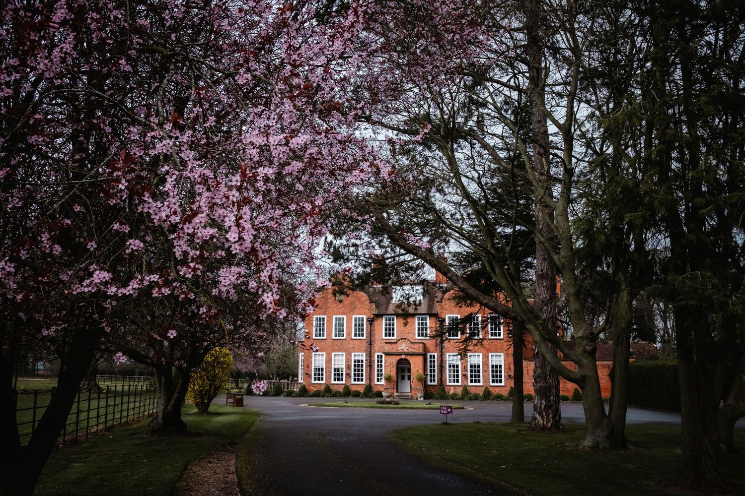 Kelham House wedding photographer capture of the country manor from the tree-lined driveway in Nottinghamshire