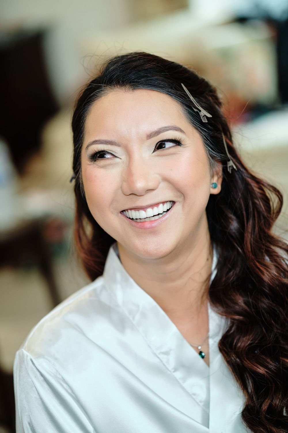 A series of candid portrait shots showing joyful expressions and natural laughter in a white collared shirt.