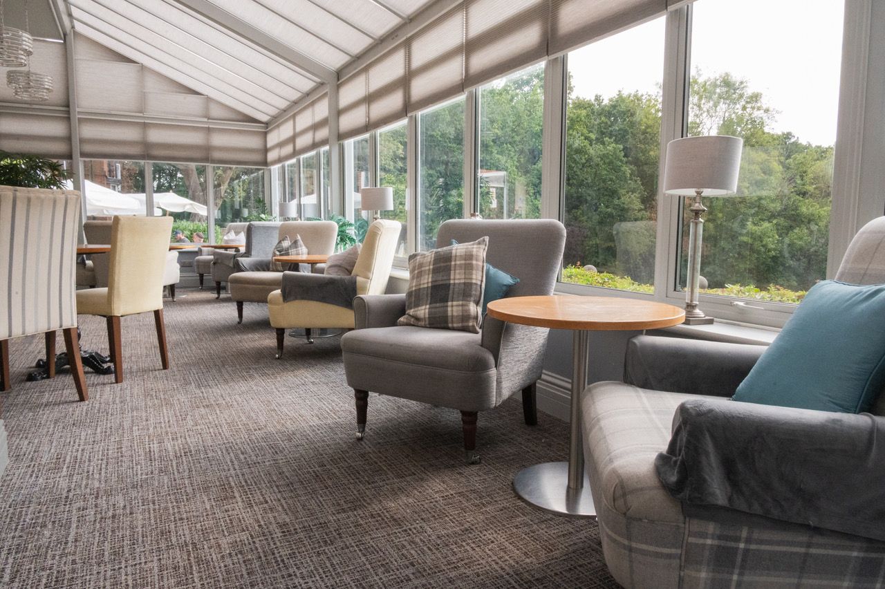 Southcrest Manor Hotel wedding photographer captures seating and dining area overlooking the manicured gardens.