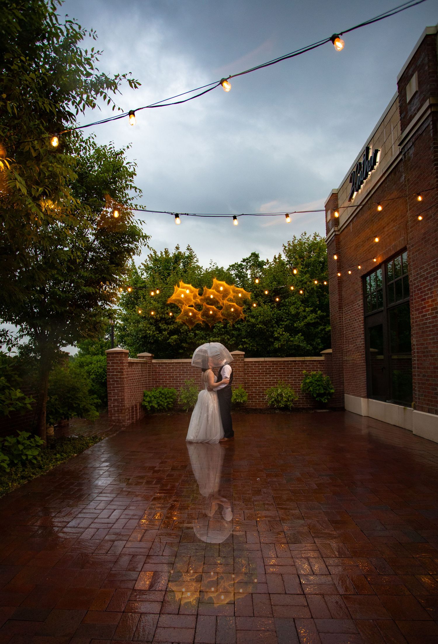 Bride and groom in rain at 2gather more wedding venue in michigan