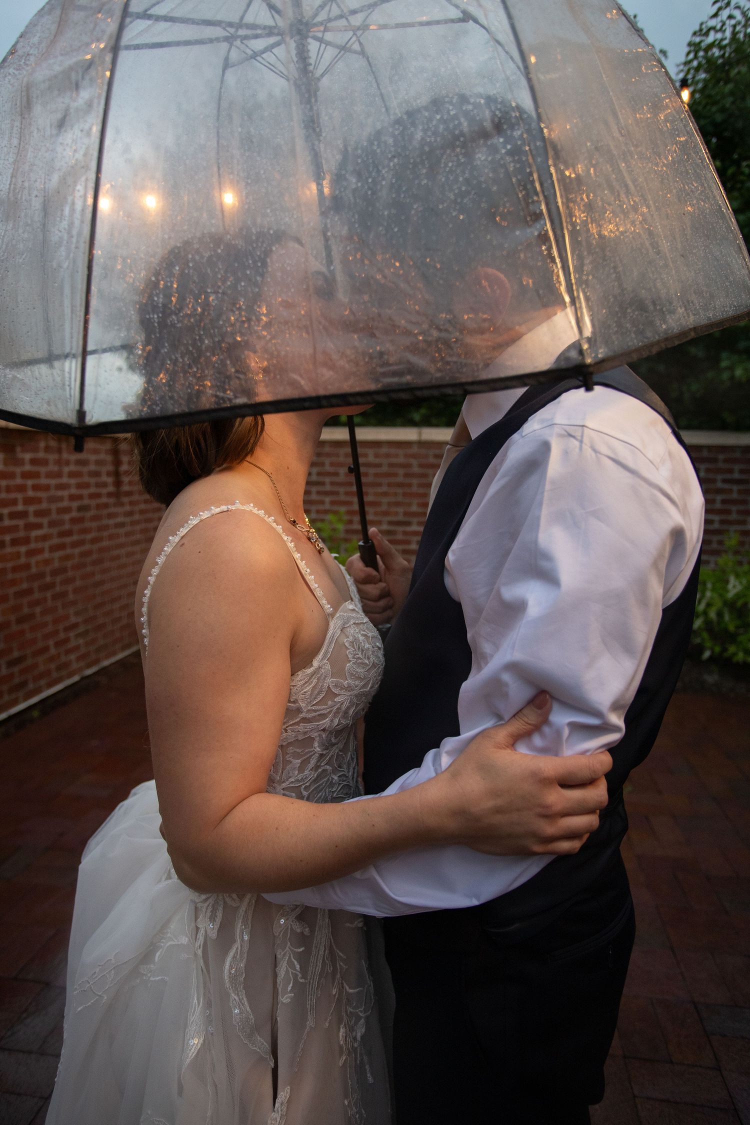 Bride and groom in rain at 2gather more wedding venue in michigan