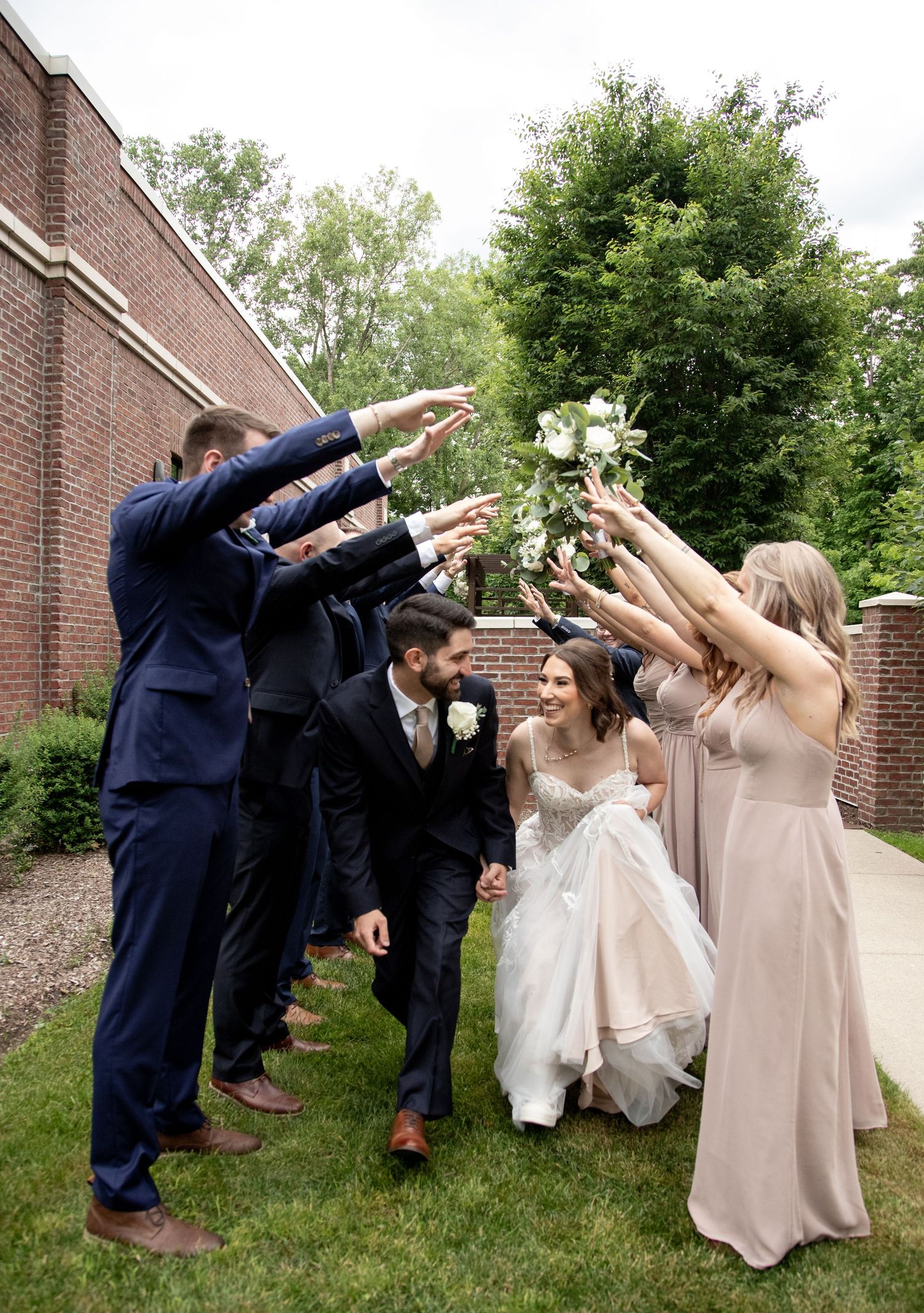 bride and groom in tunnel made my bridal party Bride and groom in rain at 2gather more wedding venue in michigan
