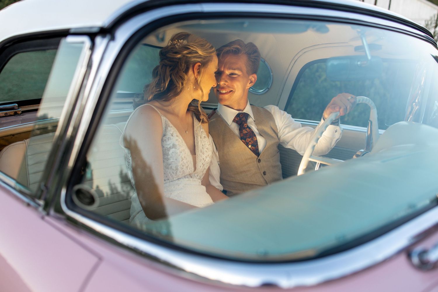 bride and groom in classic car at 2gather more wedding venue in michigan