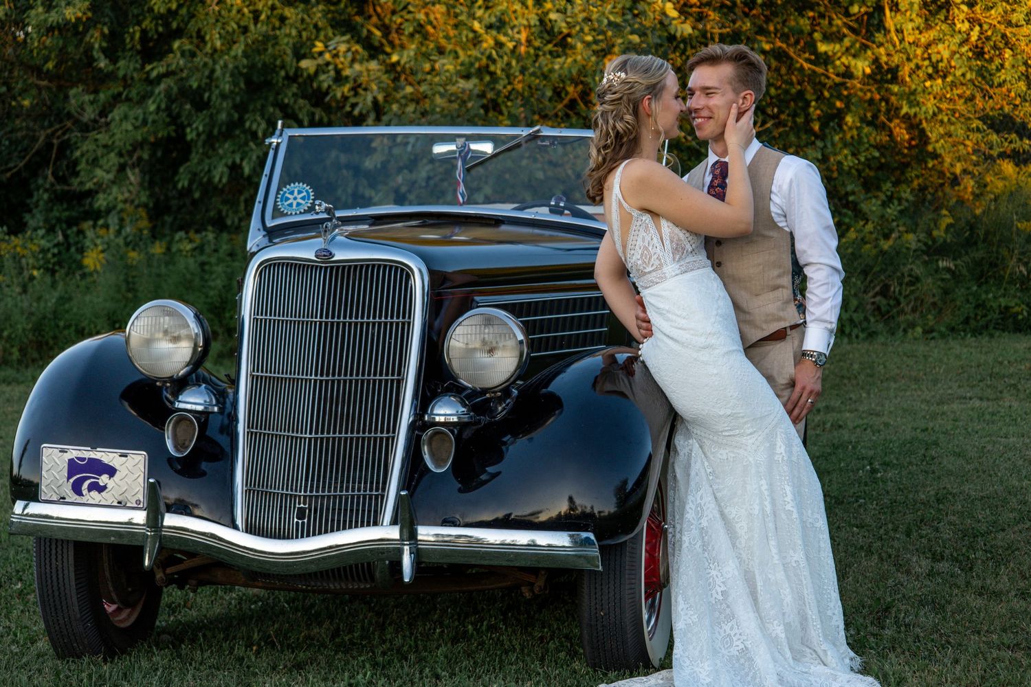 bride and groom in front of vintage classic car at 2gather more wedding venue in michigan