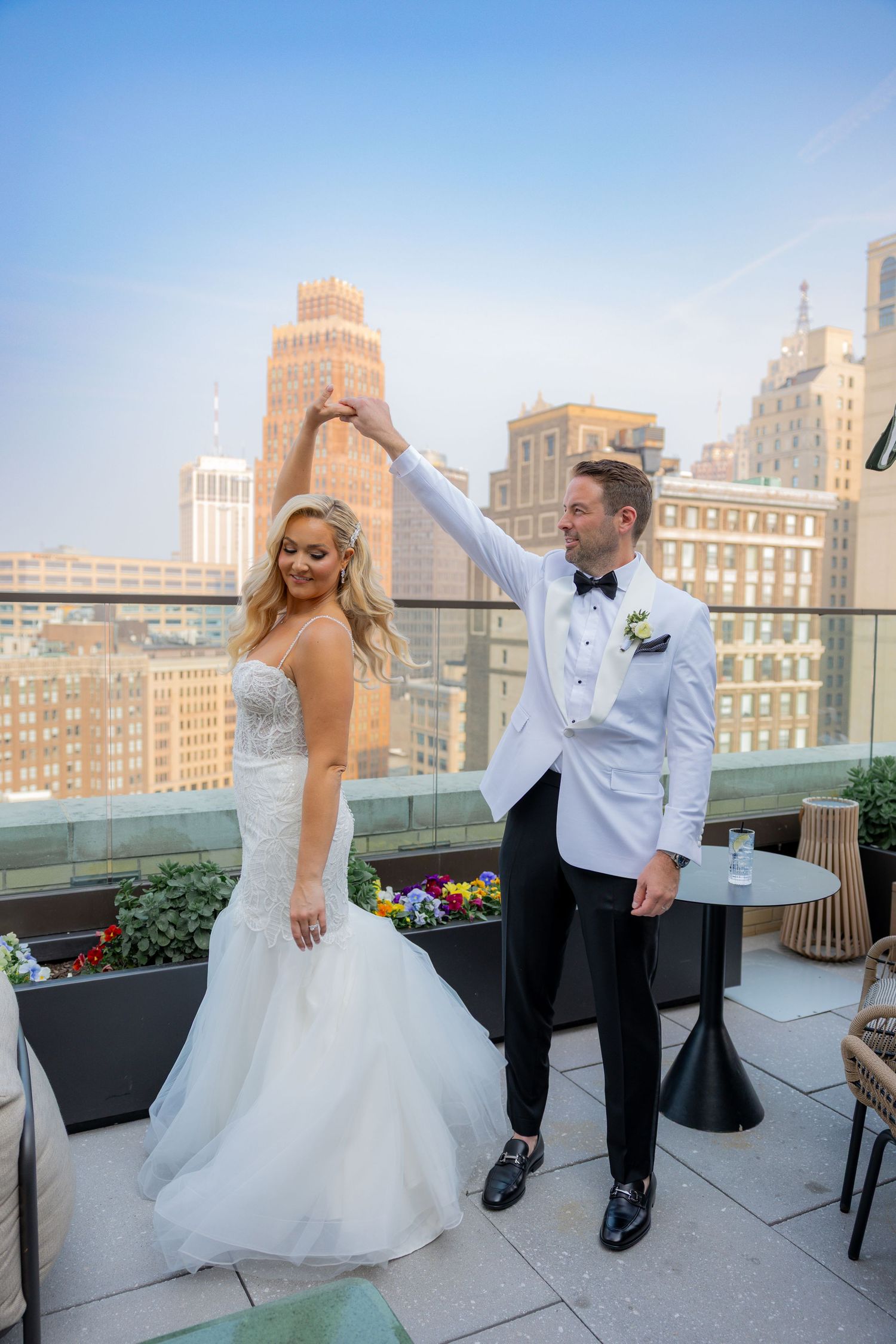 Bride and groom on rooftop at the book tower in Detroit Michigan