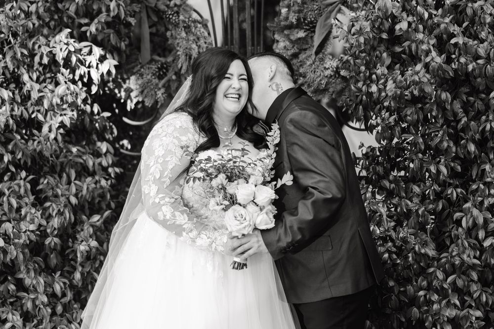 Bride and groom share romantic kisses in a series of black and white wedding photos against a leafy background.