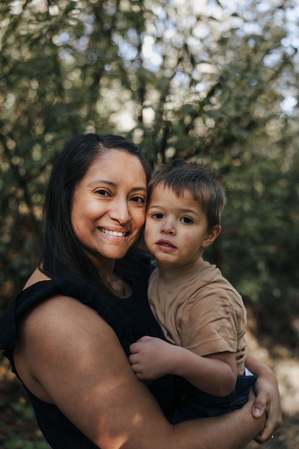 An intimate family portrait series showing joyful moments outdoors.