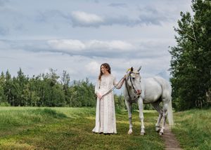 Senior photos with beautiful white horse.