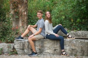 Group of romantic photos showing a couple sitting together on an old stone wall surrounded by lush greenery.