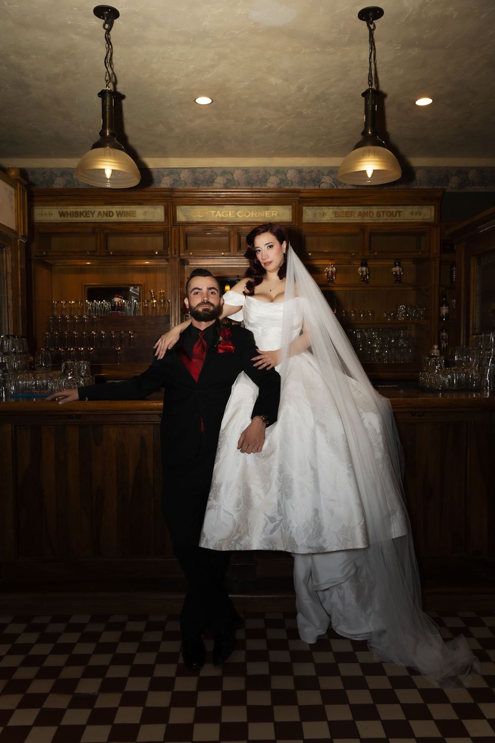 wedding portrait at The Society Room in Hartford, Connecticut featuring the bride and groom on top of the bar